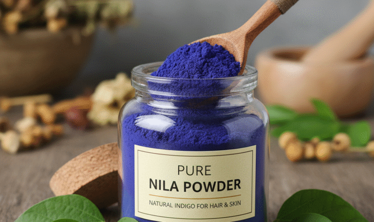 Jar of Nila powder (natural indigo) with wooden spoon and green leaves